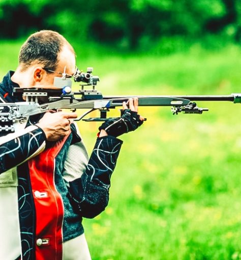 Man practicing for competition sport shooting with free rifle